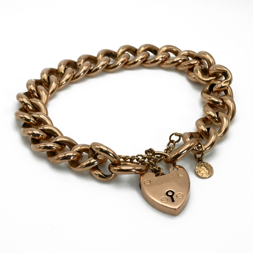 8 - A bracelet, of hollow curb links, stamped ‘9ct’ to the first link, on a padlock clasp, 21.8 grams gr... 