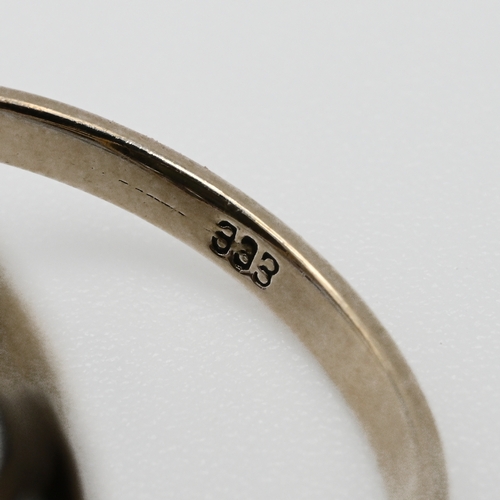 83 - A German paste set dress ring, stamped ‘333’, finger size L, 5.2 grams gross.