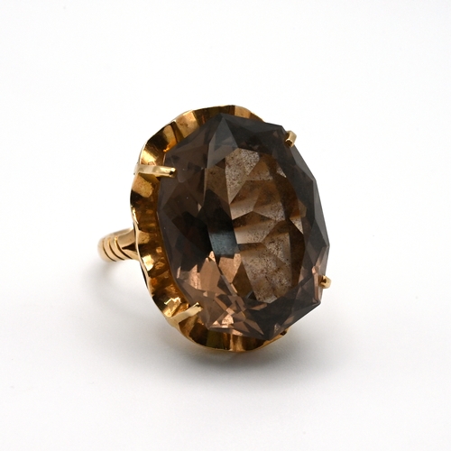 87 - A smoky quartz dress ring, stamped ‘14K’, finger size M 1/2, 8 grams gross. 