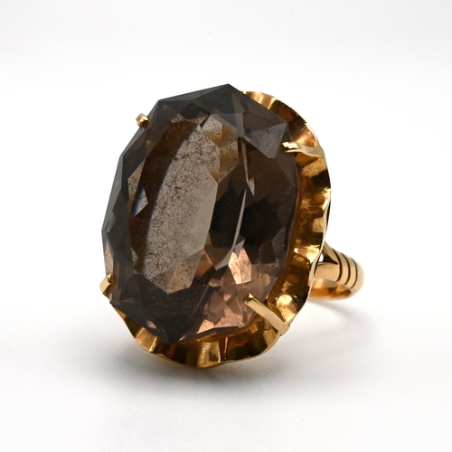 87 - A smoky quartz dress ring, stamped ‘14K’, finger size M 1/2, 8 grams gross. 