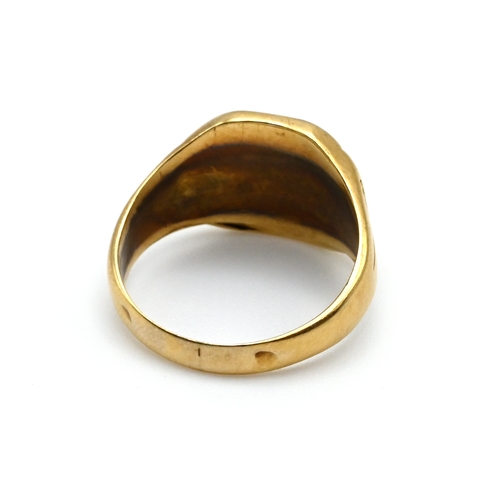 92 - An inscribed signet ring, stamped ‘750’, 2.8 grams gross.
