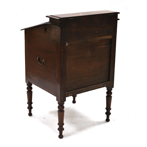 1017 - A Victorian mahogany washstand with sloping top opening to reveal recesses for wash bowl and a brass... 