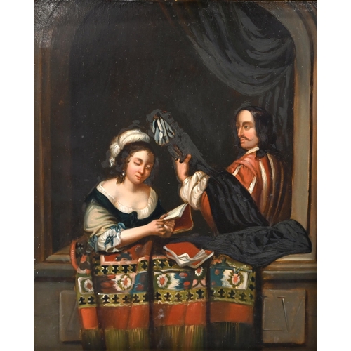 611 - After Caspar Netscher (1639-1684) - A Gentleman playing a lute to a lady holding a book at a Casemen... 