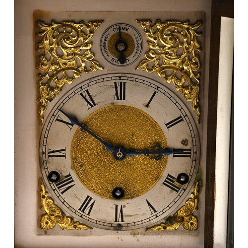 656 - An early 20th Century walnut cased bracket clock in architectural form with carved corinthian pillar... 