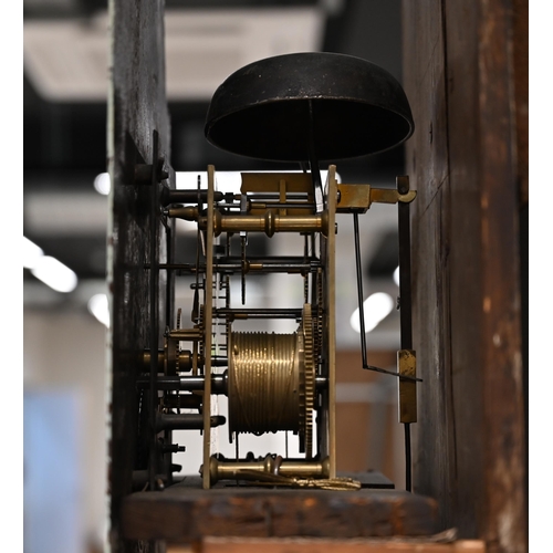 661 - An oak long case clock, circa 1800, with eight day movement, striking the hour to a bell. White dial... 