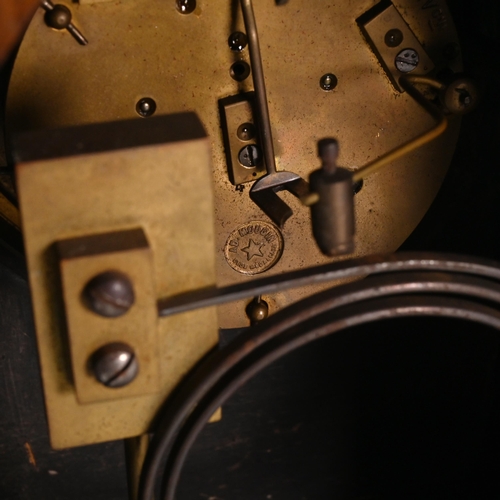 665 - A late 19th Century Lancet shaped mantle clock in mahogany case supported on brass bracket feet and ... 