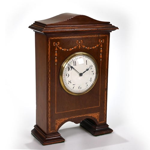 666 - A neat mahogany cased mantle clock, circa 1900, inlaid with fruitwood swags, of unusual footed form,... 