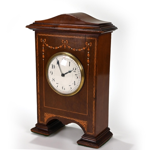 666 - A neat mahogany cased mantle clock, circa 1900, inlaid with fruitwood swags, of unusual footed form,... 