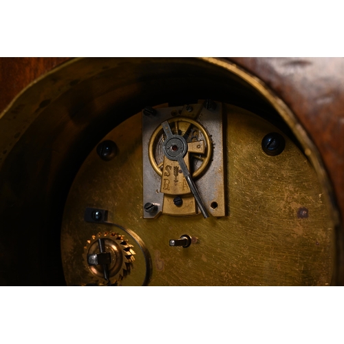 666 - A neat mahogany cased mantle clock, circa 1900, inlaid with fruitwood swags, of unusual footed form,... 