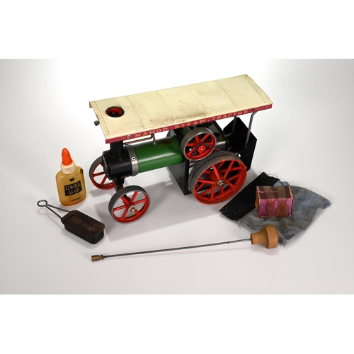 679 - A 1970's boxed Mamod T.E.1a steam tractor engine, with a green painted body, with steering rod, spir... 