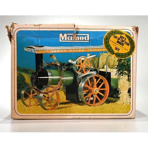 679 - A 1970's boxed Mamod T.E.1a steam tractor engine, with a green painted body, with steering rod, spir... 