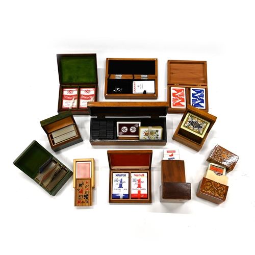 680 - A collection of 20th Century treen boxes including two cribbage boards, one containing dominoes and ... 