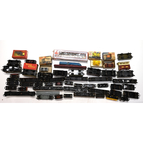 683 - A mixed box of vintage tin-type and plastic toy trains, carriages and wagons. Makers include Hornby,... 