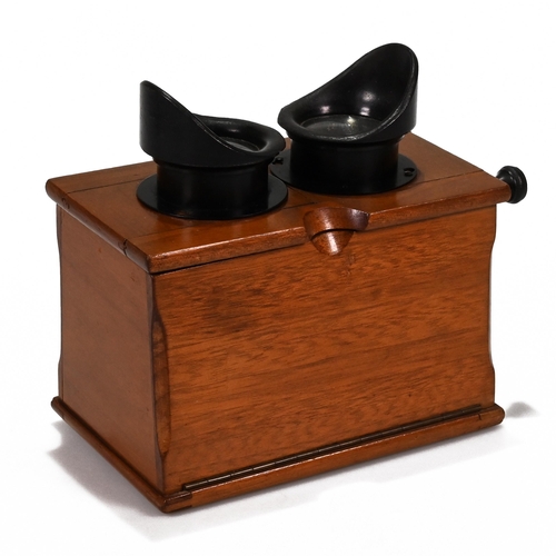 703 - A Unis of France Standard Stereoscope in Walnut case with bakelite eye pieces c1920s. Retailers plaq... 