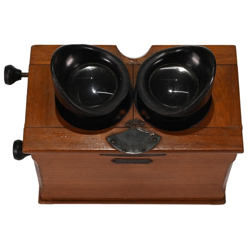 703 - A Unis of France Standard Stereoscope in Walnut case with bakelite eye pieces c1920s. Retailers plaq... 