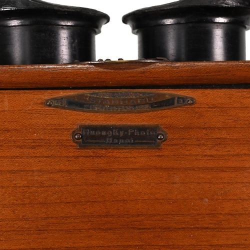 703 - A Unis of France Standard Stereoscope in Walnut case with bakelite eye pieces c1920s. Retailers plaq... 