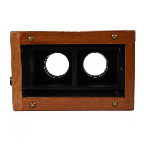 703 - A Unis of France Standard Stereoscope in Walnut case with bakelite eye pieces c1920s. Retailers plaq... 