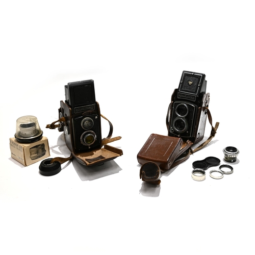 717 - Two Rolleicord Cameras in Cases together with a Dallmeyer 51mm Enlarging lens and boxed Minolta 75mm... 