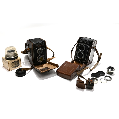 717 - Two Rolleicord Cameras in Cases together with a Dallmeyer 51mm Enlarging lens and boxed Minolta 75mm... 