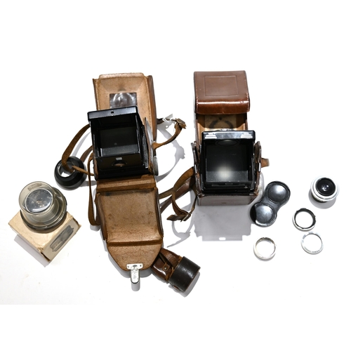 717 - Two Rolleicord Cameras in Cases together with a Dallmeyer 51mm Enlarging lens and boxed Minolta 75mm... 