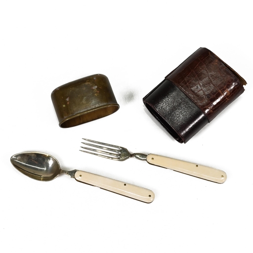 731 - A small travelling cutlery set comprising fork and spook with ivorine handles in a leather case with... 