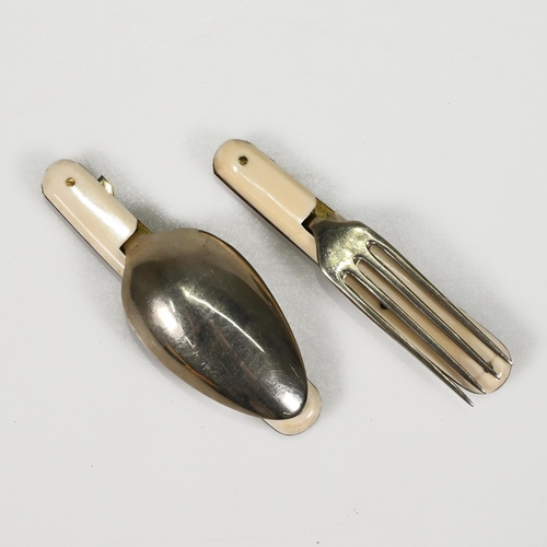 731 - A small travelling cutlery set comprising fork and spook with ivorine handles in a leather case with... 