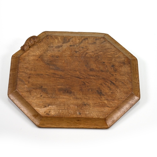 732 - An eight sided carved oak chopping board bearing the Robert Mouseman Thompson mouse to the side. 31c... 