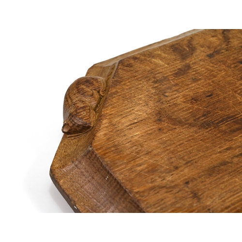 732 - An eight sided carved oak chopping board bearing the Robert Mouseman Thompson mouse to the side. 31c... 