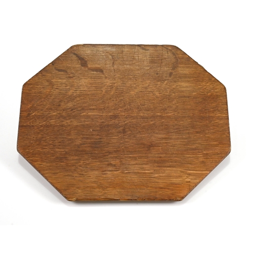 732 - An eight sided carved oak chopping board bearing the Robert Mouseman Thompson mouse to the side. 31c... 