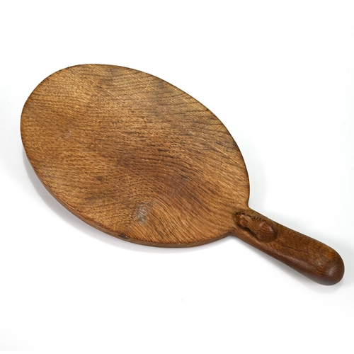 733 - An oval carved oak cheese board with the Robert Mouseman Thompson mouse carved into the handle. 37cm... 