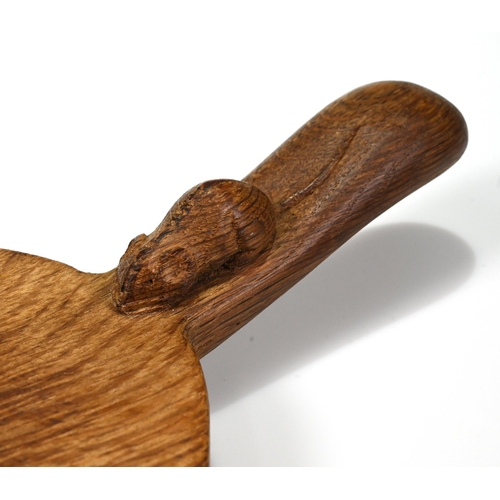 733 - An oval carved oak cheese board with the Robert Mouseman Thompson mouse carved into the handle. 37cm... 