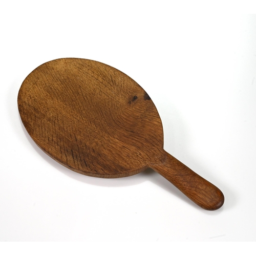 733 - An oval carved oak cheese board with the Robert Mouseman Thompson mouse carved into the handle. 37cm... 