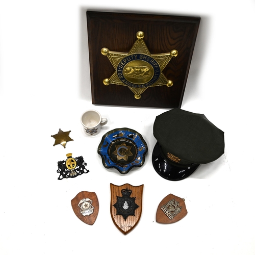 752 - A group of retro police collectables including US Sheriff's hat, plaques (5), Texas Rangers Badge, C... 