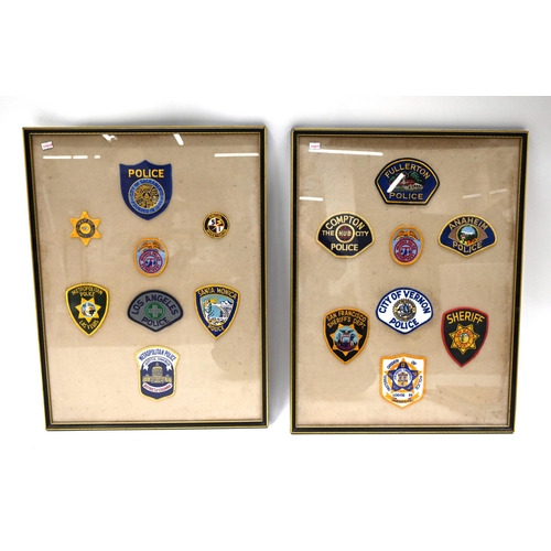 753 - A group of 32 vintage US embroidered Police patches mounted within four matching frames. Largest Fra... 