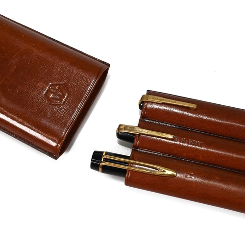 770 - A three compartment leather Waterman's pen case containing three Waterman's pens: a French made Wate... 