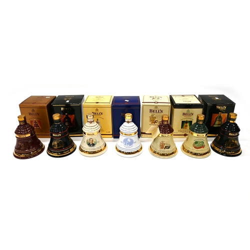 822 - Seven bottles of Bells celebration whiskey decanters, all boxed and unopened, to include Christmas 1... 