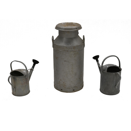 867 - An galvanised milk churn with lid, United Dairies, 74cm high, 35cm diameter, along with two galvanis... 