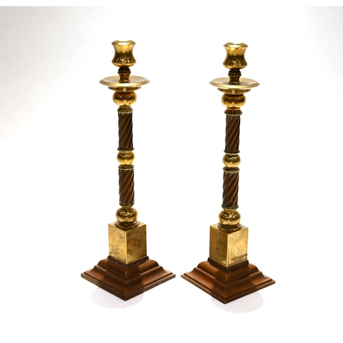 870 - A pair of oriental brass, copper and bakelite candlesticks 39cm tall.