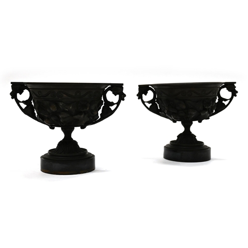 871 - A pair of 19th Century Grand Tour bronze two handled drinking cups mounted on round marble socles. E... 