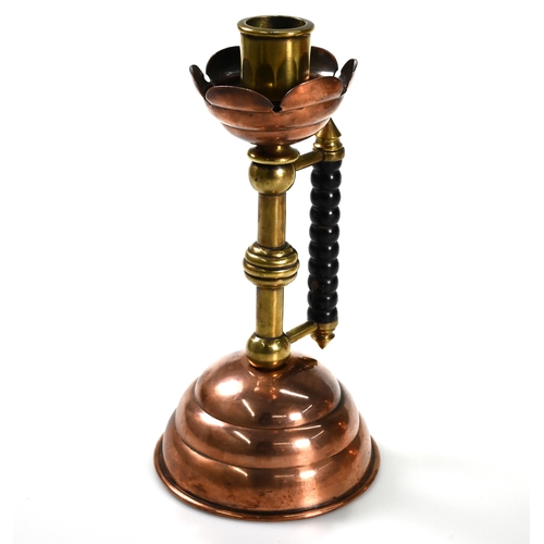 874 - Arts and Crafts copper to include: a brass and copper candlestick in the manner of Christopher Dress... 