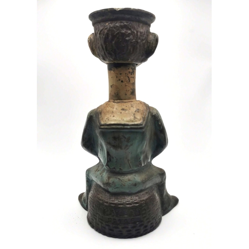 882 - An early 20th Century cast iron novelty nutcracker titled ' Tough Nut' in the form of a sailor sitti... 