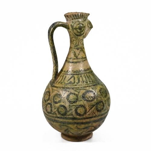 887 - A Seljuk Kashan cockerel headed pottery ewer, decorated in geometric green glazes over a yellow grou... 