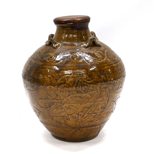 892 - A late 19th century Chinese martaban stoneware jar, set with four rope twist handles to the shoulder... 