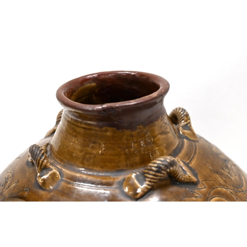 892 - A late 19th century Chinese martaban stoneware jar, set with four rope twist handles to the shoulder... 