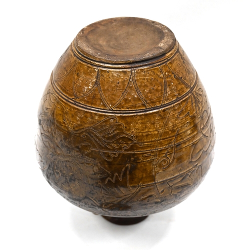 892 - A late 19th century Chinese martaban stoneware jar, set with four rope twist handles to the shoulder... 