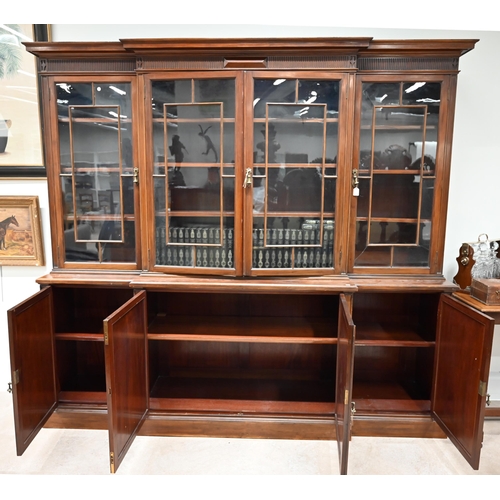 903 - A large late Victorian Mahogany breakfront bookcase marked for Waring & Gillow c1890s. Panelled cupb... 