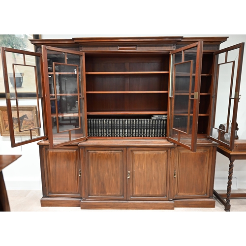 903 - A large late Victorian Mahogany breakfront bookcase marked for Waring & Gillow c1890s. Panelled cupb... 