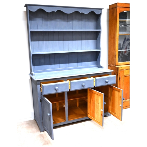 911 - A late 20th Century blue painted pine dresser with two shelves above and three drawers below. Cupboa... 