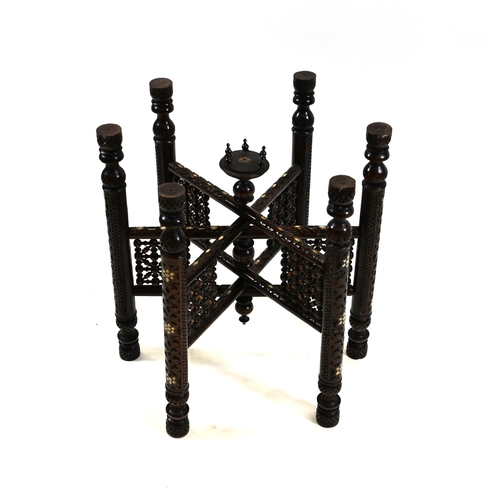 913 - An antique Indian Benares table with a scallop-edged brass top intricately chased with scrollwork an... 