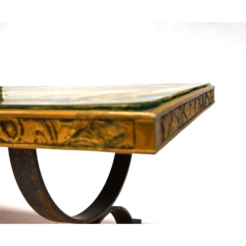 919 - A mid 20th Century Coffee table with steel strap legs and wood and resin top. This reputedly depicts... 